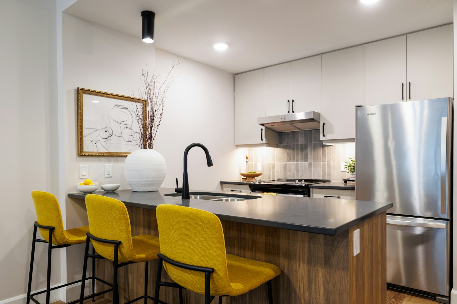 Modern kitchen with updated countertops and stainless steel appliances